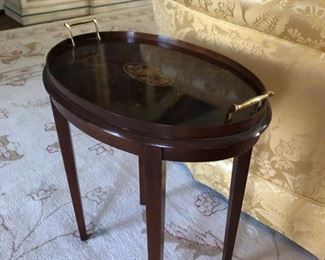 Vintage oval mahogany Butler's tray table with floral inlay. Measures 14" W x 5" D x 14" H. Photo 1 of 2.