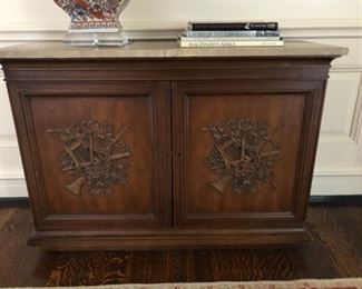 Vintage marble-topped two-door cabinet with hand carved cartouche featuring olives, roses, horns and lyres. Measures 41"W x 14"D x 29 1/2"H.