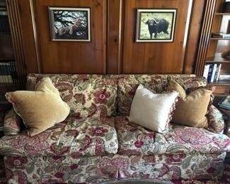 Pink and raspberry floral custom upholstered sofa with down cushions. Measures 79" L x 28" H x 35" D.