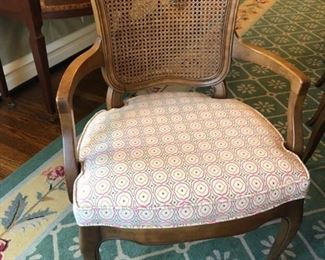 Set of 8 cane-back dining chairs upholstered in pink and green fabric. Photo 1 of 2.
