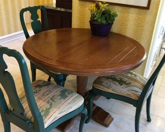 42" round pedestal dining table. Comes with 6" extension leaf.