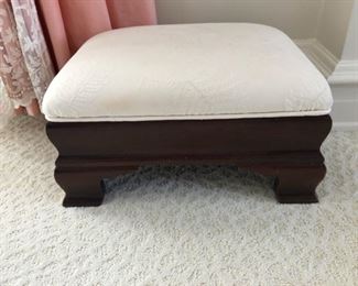 Upholstered footstool.
