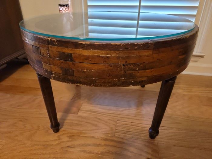 https://ctbids.com/#!/description/share/687770 Antique Wooden Flat Belt Farm Pulley Wheel Table. This is a one of a kind table! Industrial steampunk. This is a huge original antique wooden farm pulley measuring 28" in diameter. It stands 18" tall. 

