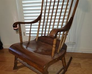 https://ctbids.com/#!/description/share/687769 This rocking chair is perfectly carved to fit your behind! It has a nice wide seat and a comfortable rocking motion. Its 41" tall at the back and 14" tall at the seat. The rocker legs are 26" long and the seat base is 22" x 19" wide.