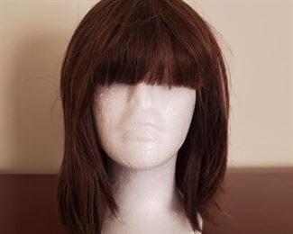 https://ctbids.com/#!/description/share/687775 Cute brown styled wig made from real hair. Hair is approximately 12" and bangs 5" Foam head included.
