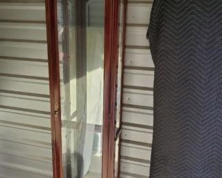https://ctbids.com/#!/description/share/687790 Pulaski Furniture lighted curio in cherry finish. No glass shelves found. Dimensions 19x12x76"