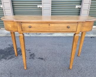 https://ctbids.com/#!/description/share/687799 Wooden table stands 31" tall, 53" long, 17" from the wall. The drawer is 24" x 12"wide, 2" deep.