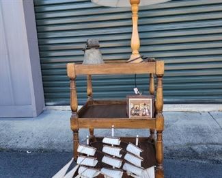 https://ctbids.com/#!/description/share/687809 The wooden spindle table has 3 shelves and is 29" tall and 18" x 18"wide. The wooden picture is 6" x 6" wide. The beautiful Cutty Sark ship is 19" tall and 21" long. The camel foot bell is a real piece of history!! It stands 7" tall. The lamp stands 26" tall.