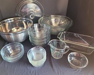 https://ctbids.com/#!/description/share/687824 A set of stackable Pyrex bowls. The largest is 12" across, the smallest is 7" across. Four glass cereal bowls are 6" across. The Pyrex bread dish is 8x5.