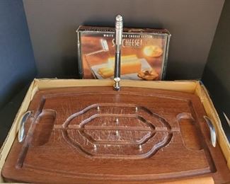 https://ctbids.com/#!/description/share/687849 Very nice vintage provincial wooden carving board. Board features handles, spikes on base and an adjustable height skewer 20x14x10" Marble cheese slicer 8x6"