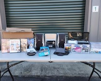 https://ctbids.com/#!/description/share/687807 This is a great mix of electronics. We have a Panasonic radio. There is a box of miscellaneous CDS with everything from Sinatra to Van Halen! There are some mixed box sets of the fabulous fifties and a 30 pack of CD cases. We have an answering machine and a car Garmin. There is a Roku Express and some classic DVDs. And this includes a full box of connecting cords!