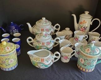https://ctbids.com/#!/description/share/687804 Really cute collection of Asian tea sets. Teapots range in height from 4-7".