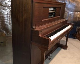 Player piano with wood chest full of scrolls. Working. Free. This is very heavy and it will be your responsibility to move 