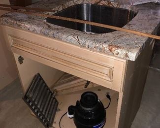 Sink cabinet with granite counter top and garbage disposal. Like new!! Mill took cabinetry. 