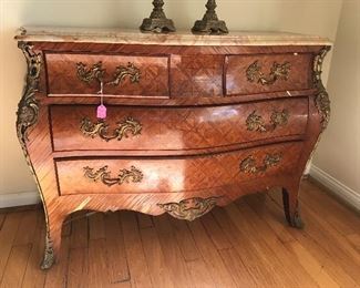 $1,200.  French inlay veneer bombe chest with bronze mounts and marble top.  As is, veneer needs restoration.  51"Wx21"Dx35"H