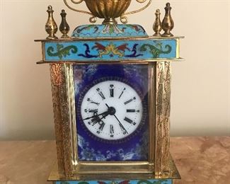 $200 Enamel and brass clock.  Height 9"