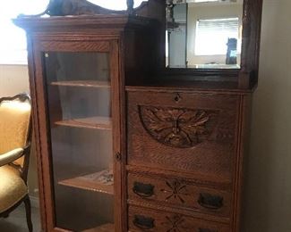 $350 Old quarter sawn oak curio cabinet with carved mask on pulldown front.   Height 67"x Width 46" x Depth 12"