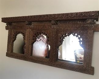 $250 Indonesian or Indian carved mirror/shelf unit.  Length 52"