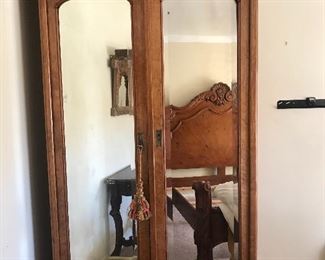 $350  Large antique armoire with beveled mirrors and bottom drawer.  Missing one drawer pull.  Height 90" x Width 4' x Depth 19"