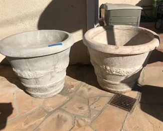 $100 each.  Two concrete planters -- as is.  21"x24"