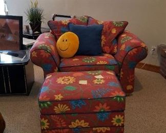 red floral chair and ottoman