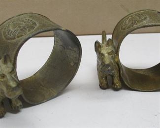 A pair of vintage Japanese Scottie dog napkin rings.  Silver and gold tone plated. 1.75" tall
