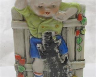 Vintage Japanese porcelain wall pocket.  Has relief image of a child playing ball with a 
Scottie Dog.  5.25" tall.  