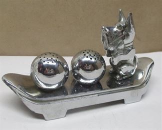 Vintage Japanese Deco chrome salt and pepper shakers with Scottie dog figure and two ball form shakers on a base.  On lid has some corrosion and hasn't been opened. Base is 5.25" long
