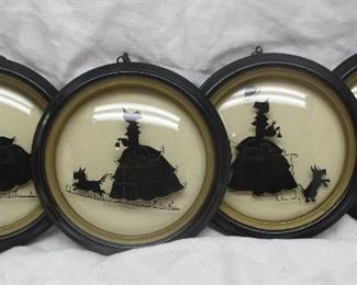 Four matching framed convex glass with images of a woman in a southern belle dress and a Scottie dog.  5.5" diamter.  

