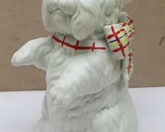 MANN Japan bisque type Scottie dog figure with music box.  Plays "you take the high road and I'll take the low road".  Dog spins while playing.  6.5" tall
