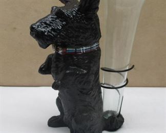 A 4.75" tall black Scottie dog figure with wire on its' back which holds a glass bud vase