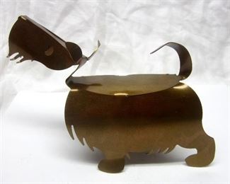 A Scottie figure made of cut out sheet of copper.  Approximately 7" long, 4.75" tall
