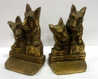 Pair of vintage cast iron brass plated Scottie dog bookends.  Each with figure of two dogs sitting on timbers.  6.25" tall
