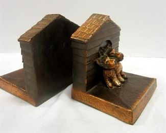Pair of vintage metal bookends in the form of two Scottie Dogs in dog houses.  Copper plated. 4 1/8" tall, 3.5" wide
