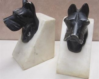 Pair of Deco white marble small bookends with black painted Scottie dog heads.  4.25" tall.  Some wear to bases and black paint from use.  
