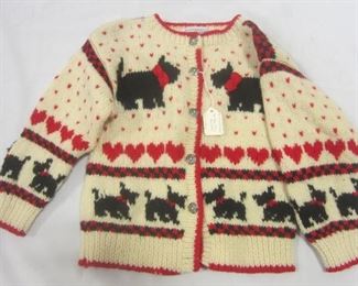 A Scottie dog theme child's sweater. Tag reads "one of a kind by Shirley Duffy.  Size 3-4

