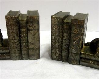 Pair of vintage Japanese white metal silvered bookends.  These are in the form of a stack of books, each with a Scottie dog figure.  3.5" tall, 4.75" wide
