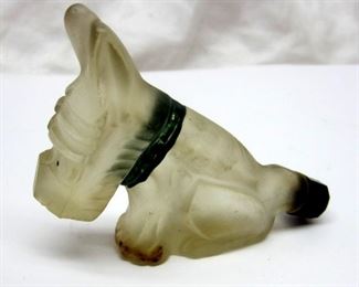 Older Scottie dog form bottle with cap.  Satin finish, painted eyes and collar.  2.5" tall.  Marked "MADE IN ROMANIA" not visible in photo
