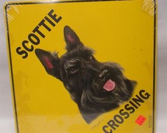 A contemporary decorative Scottie crossing sign.  DOGWALKS by Atlas Screen Printing.  Still in shrink wrap.  12"x12"
