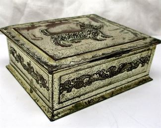 A vintage Japanese silver plated cigarette box with Scottie dog motif on the lid.  Inside lined with wood.   4.5" wide, 1.5" tall.  Wear on lid from use
