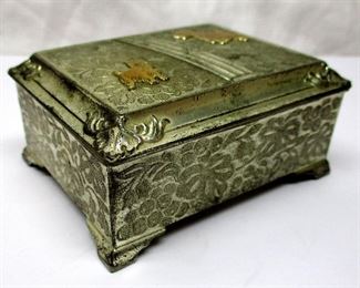 A vintage Occupied Japan silver plated trinket box with two gold tone Scottie figures  on the lid.  Inside lined with wood.   3.25" wide, 1.5" tall.  Marked "Continental New York Silver Plated"
