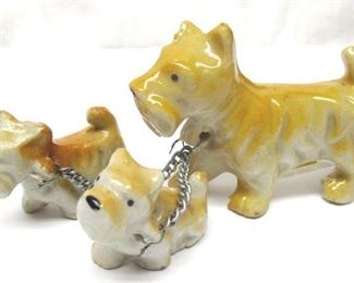 Miniature Scottie dog mother and pups on chains