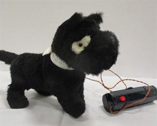 A vintage battery operated toy Scottie dog.  7" tall, 10.5" long nose to tail.  Not tested
