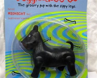 Doggie-a-Go-Go, the groovy pup with the zippy legs.  meet MIDNIGHT the supercool canine.  Flip the tail and this pup zooms around on his battery-propelled paws.  ca 1999.  Not removed from box.  Figure is 4.5" tall, 5" wide