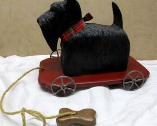 Vann Scott folk artist Vannimal limited edition casting Scottie dog pull toy.  Signed and numbered 16.  Base is 4.5" x 7.75".  Not actually a toy, for display purposes