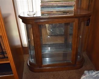 Beautiful Quality Display Case featuring Curved Glass Sides, Glass Shelving with Mirrored Back and Lighted!