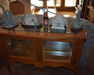 Beautiful Sofa Style Display Cabinet of Solid Oak with Mirrored Back, Glass Shelving plus Figurines and Collectibles are displayed on top.