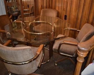 Breakfast or Game Table with Glass Beveled Top and 4 Matching "castered" Chairs.