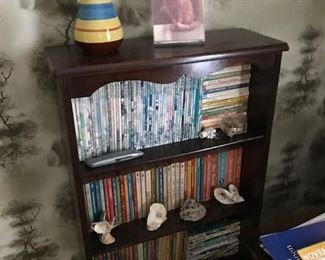 Small book shelf with magazines.