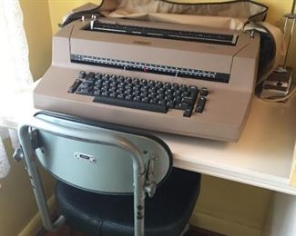 Vintage typewriter and office chair.